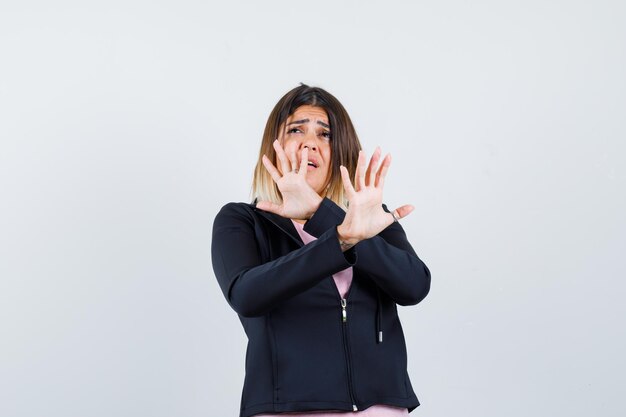 Expressive young lady posing in the studio