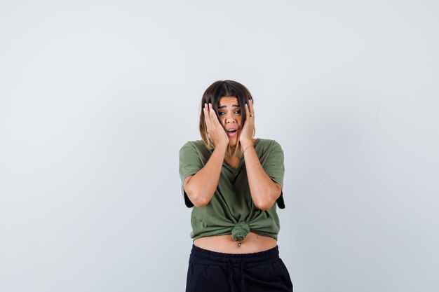 Expressive young lady posing in the studio