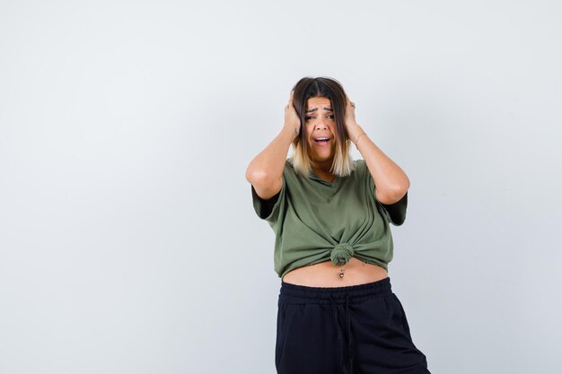 Expressive young lady posing in the studio