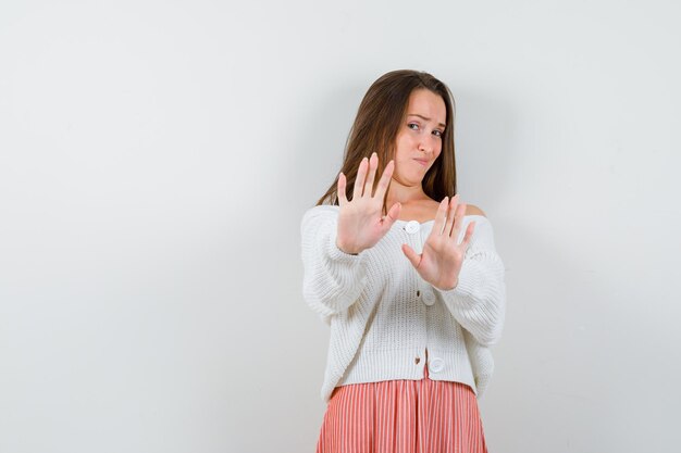 Expressive young lady posing in the studio