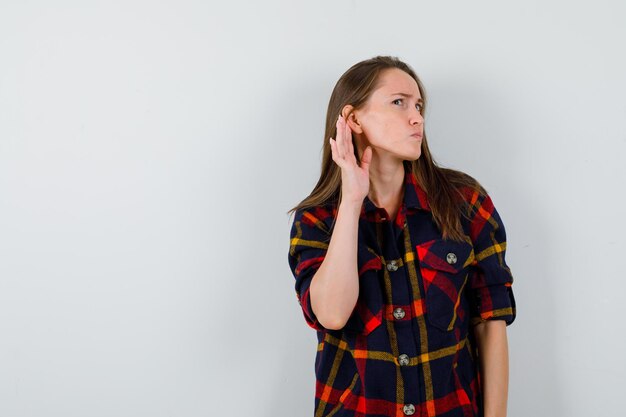 Expressive young lady posing in the studio