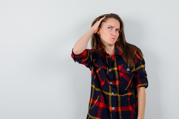 Expressive young lady posing in the studio