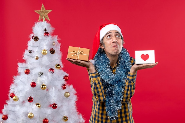 Free photo expressive young man posing for christmas