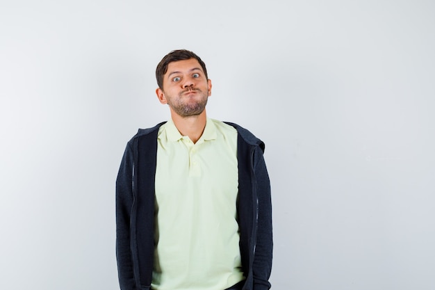 Expressive young man posing in the studio