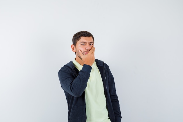 Expressive young man posing in the studio