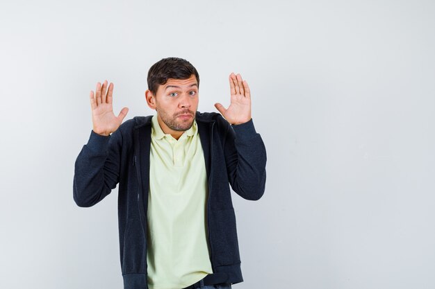 Expressive young man posing in the studio