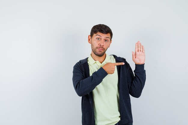 Expressive young man posing in the studio