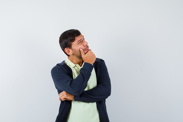 Expressive young man posing in the studio