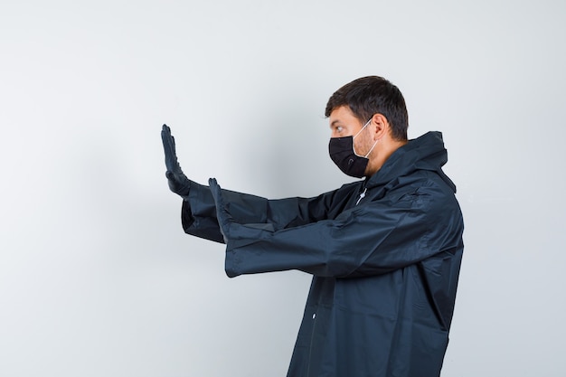 Expressive young man posing in the studio