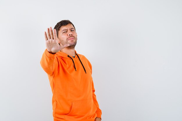 Expressive young man posing in the studio