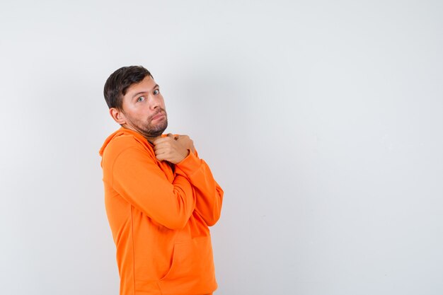 Expressive young man posing in the studio