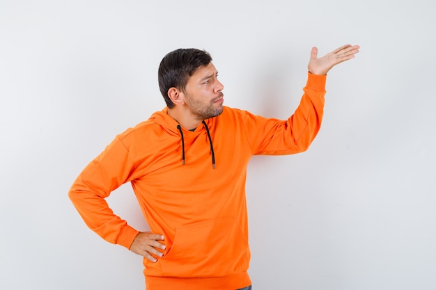 Expressive young man posing in the studio