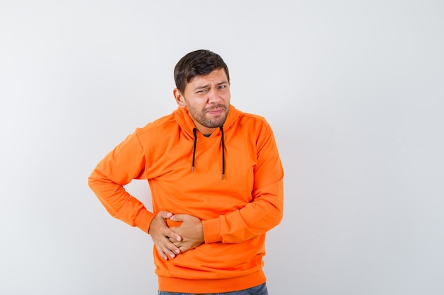 Free photo expressive young man posing in the studio