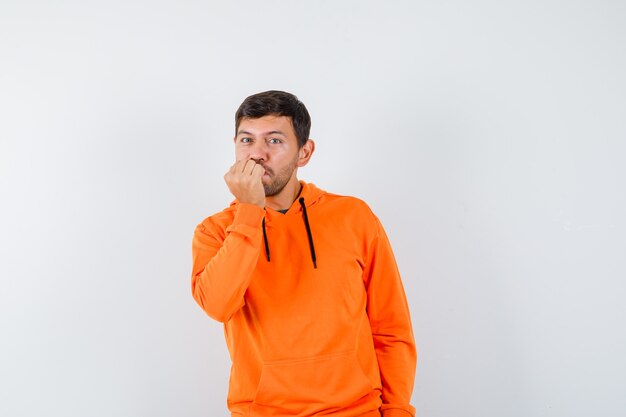 Expressive young man posing in the studio