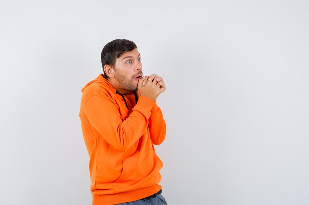 Expressive young man posing in the studio