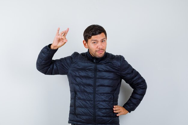 Expressive young man posing in the studio