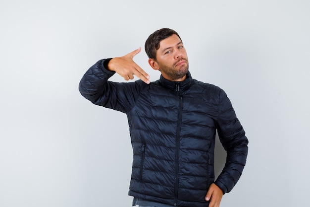 Expressive young man posing in the studio