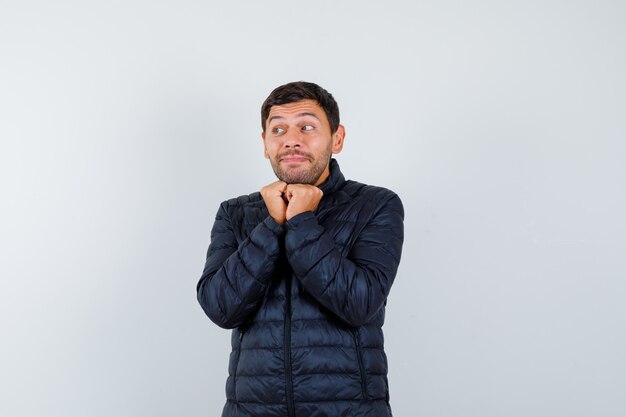 Expressive young man posing in the studio