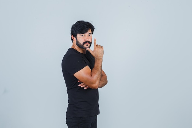 Expressive young man posing in the studio