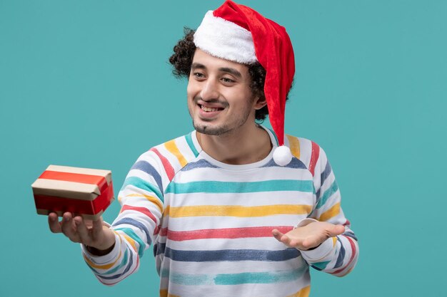 Expressive young man posing for winter holidays