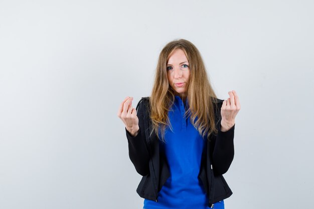 Expressive young woman posing in the studio