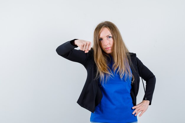 Expressive young woman posing in the studio