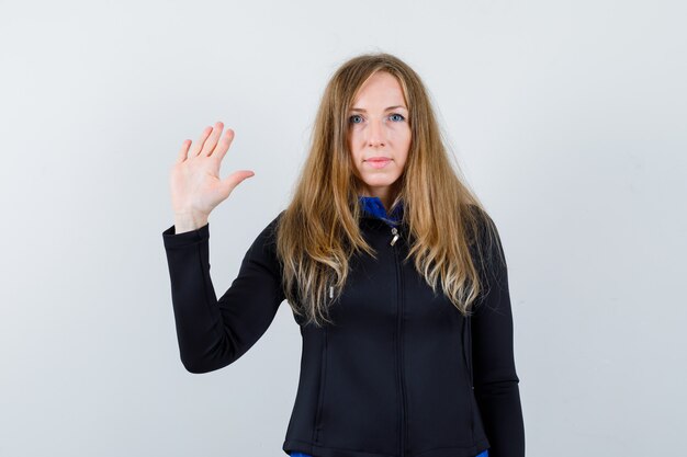 Expressive young woman posing in the studio