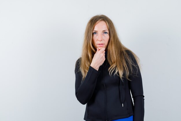 Expressive young woman posing in the studio