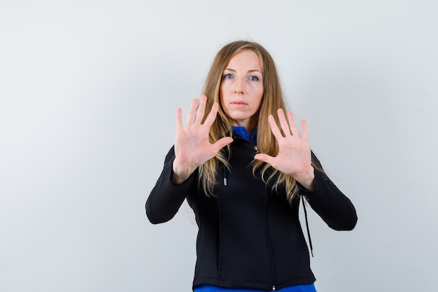 Expressive young woman posing in the studio