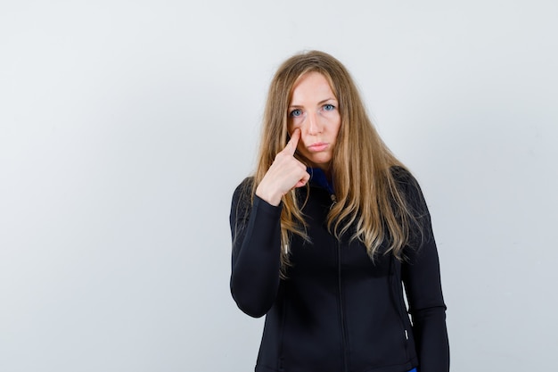 Expressive young woman posing in the studio