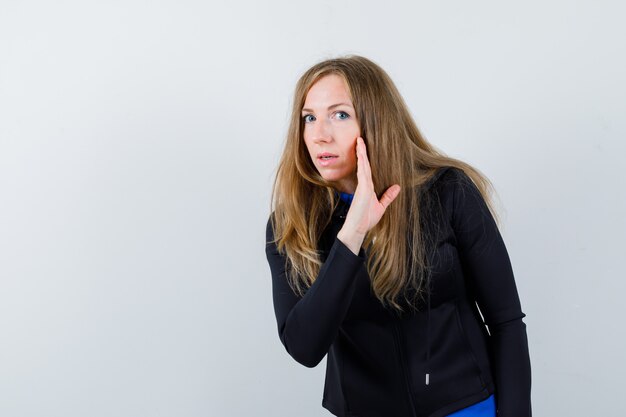 Expressive young woman posing in the studio