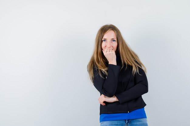 Expressive young woman posing in the studio