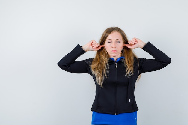 Expressive young woman posing in the studio