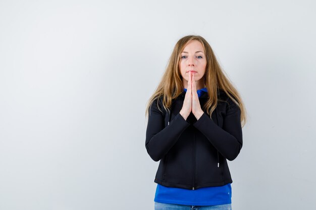 Expressive young woman posing in the studio