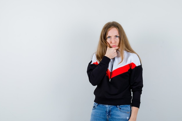 Expressive young woman posing in the studio