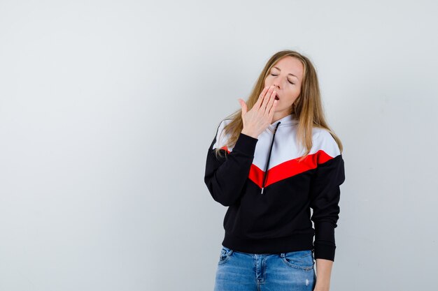 Expressive young woman posing in the studio