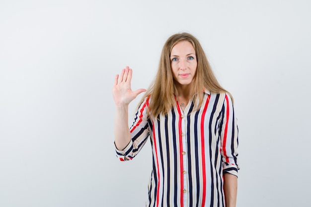 Expressive young woman posing in the studio