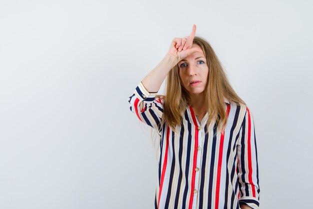 Expressive young woman posing in the studio