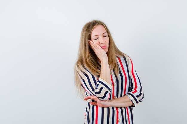 Expressive young woman posing in the studio