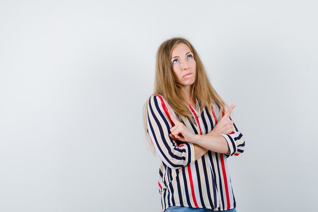 Expressive young woman posing in the studio