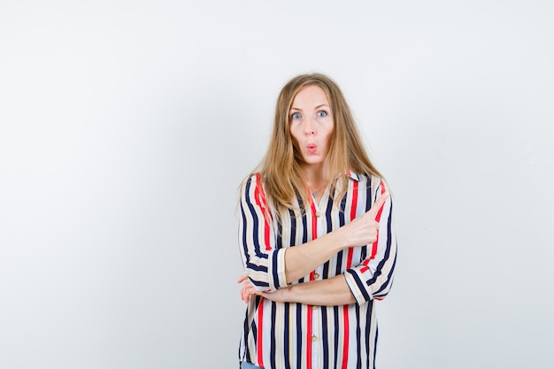 Expressive young woman posing in the studio