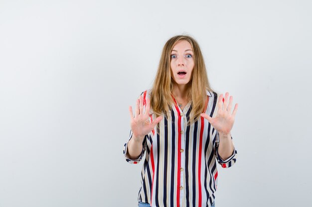 Expressive young woman posing in the studio