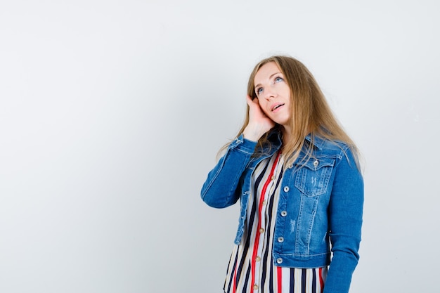 Expressive young woman posing in the studio