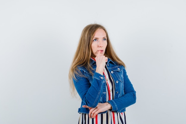 Expressive young woman posing in the studio