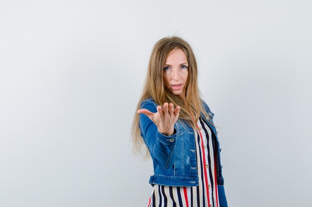 Expressive young woman posing in the studio