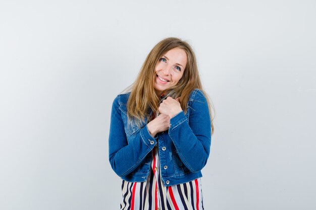 Expressive young woman posing in the studio