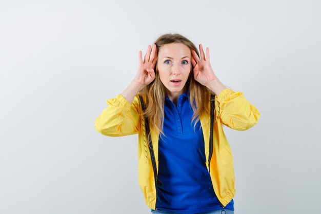 Expressive young woman posing in the studio