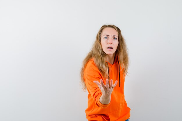 Expressive young woman posing in the studio