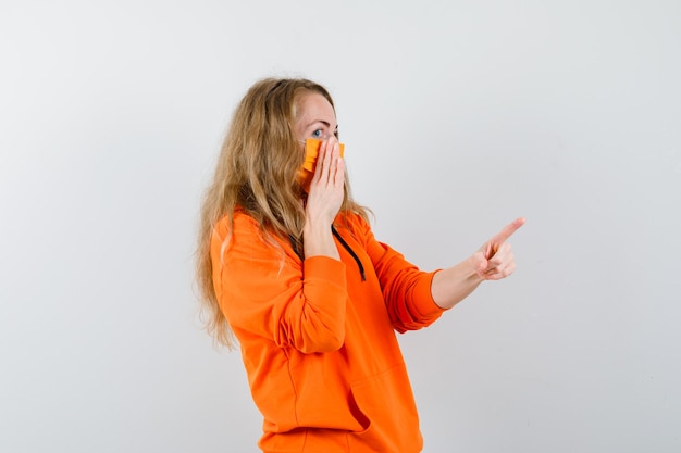 Expressive young woman posing in the studio