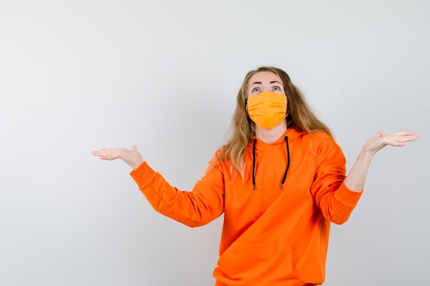 Expressive young woman posing in the studio